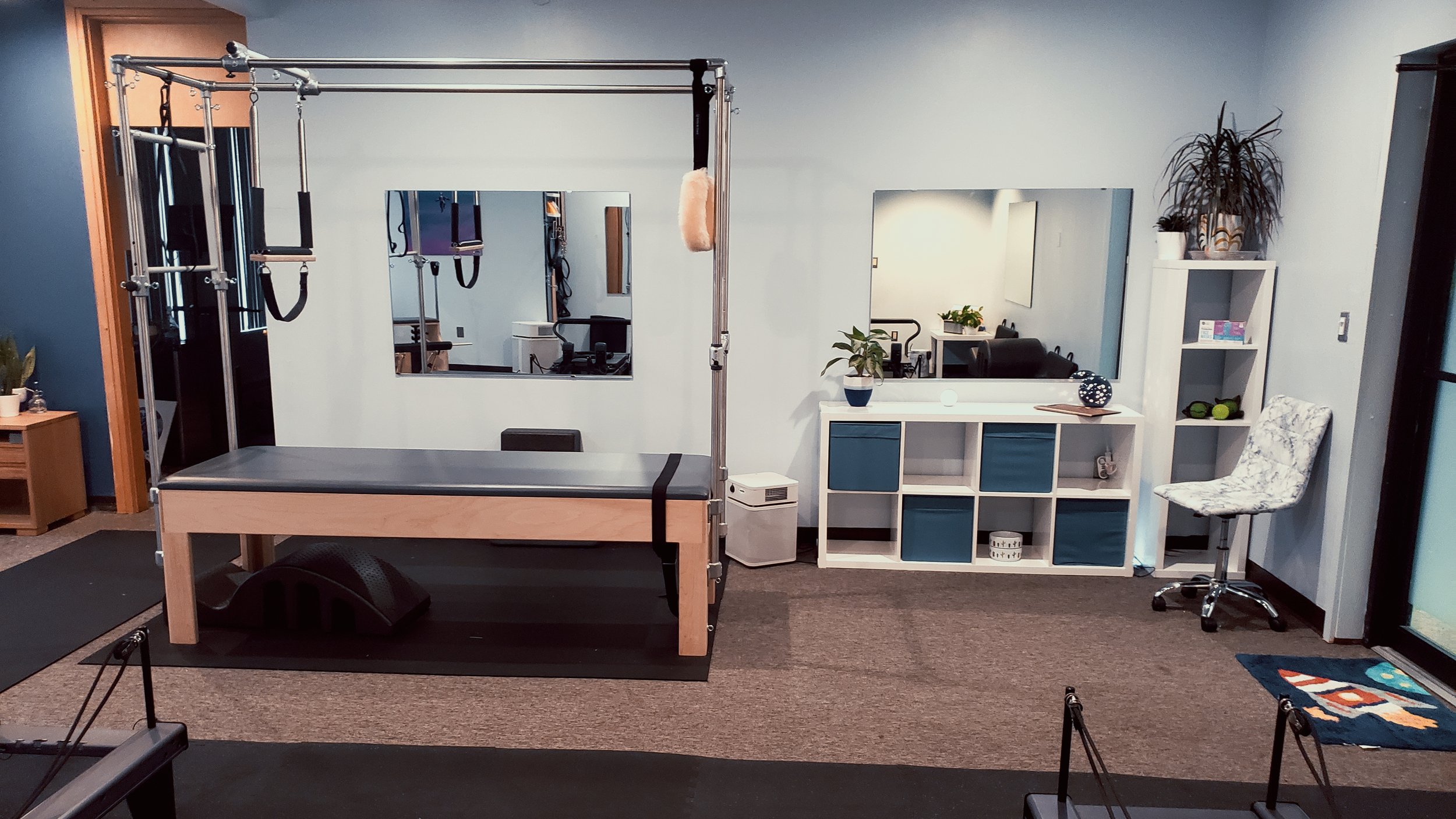 Pilates tower and mat equipment in the studio